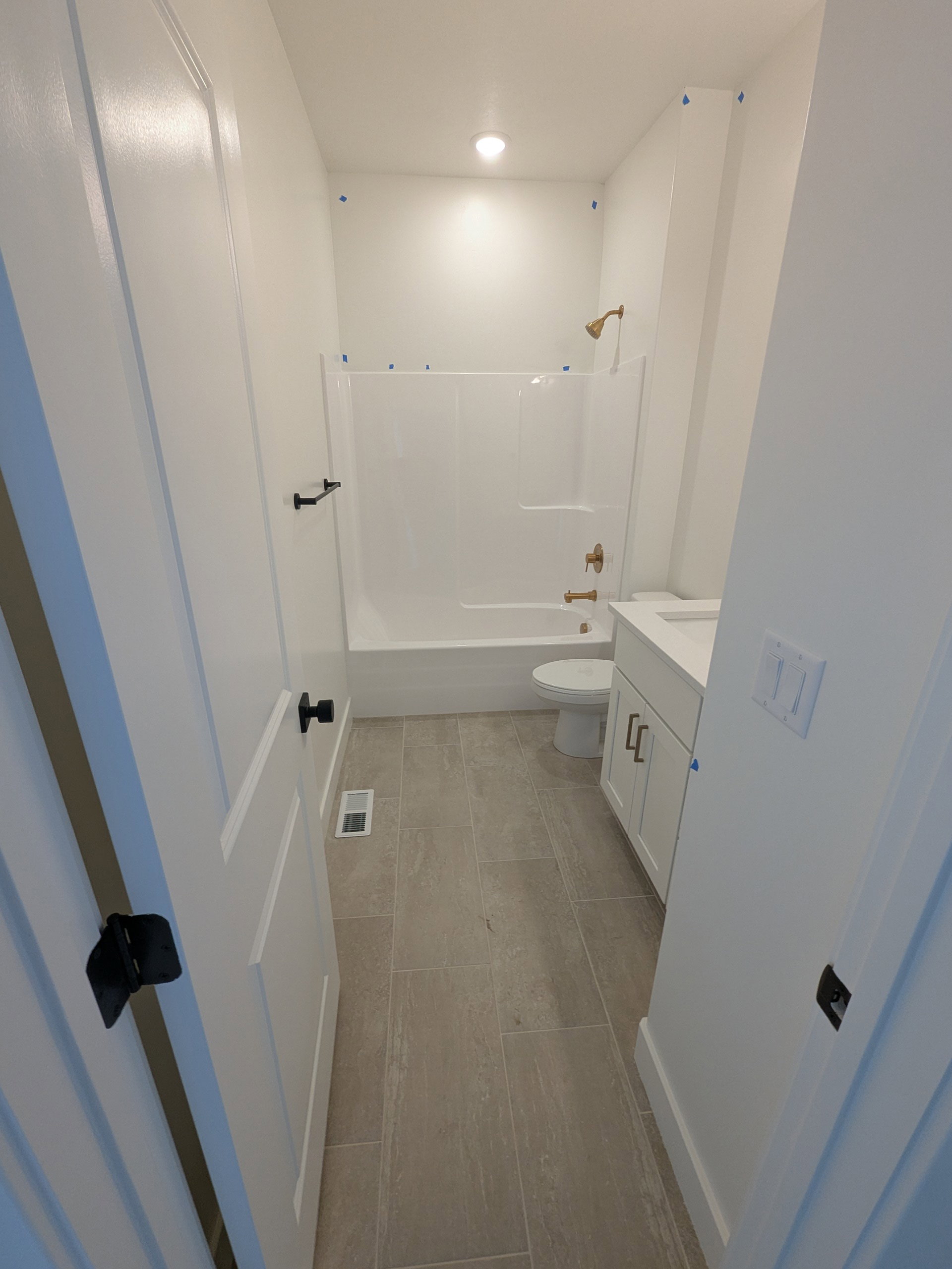 Full bath featuring vanity, bathing tub / shower combination, light wood-style flooring, and recessed lighting