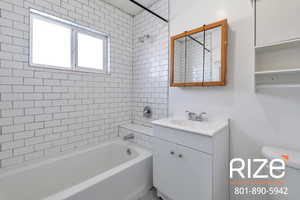 Full bathroom with vanity and shower / bath combination
