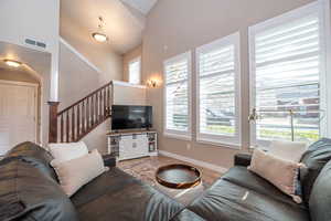 Living Room With Tons of Windows with Mountain Views and Lovely Plantation Shutters