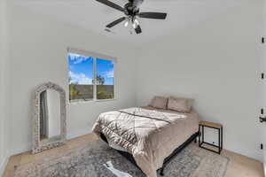 Bedroom featuring light wood-style flooring and a ceiling fan