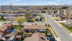 Aerial perspective of suburban area featuring a mountainous background