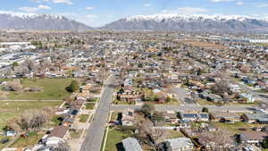 Aerial view of residential area featuring a mountain backdrop