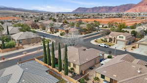 Aerial view of residential area featuring a mountainous background