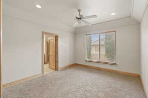 Unfurnished room featuring a ceiling fan, light colored carpet, and recessed lighting