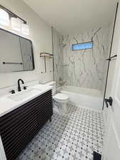 Bathroom with vanity and shower / tub combination