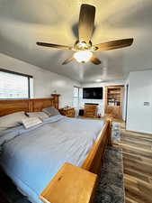 Bedroom #1 with ceiling fan, and a textured ceiling