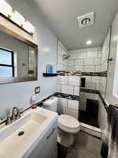 Primary master bathroom #2. Standup shower with bench seat.
