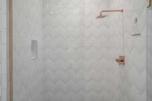 Bathroom featuring tiled shower