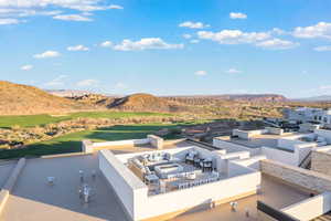 View of patio / terrace featuring a mountain view, an outdoor lounge area, and view of golf course