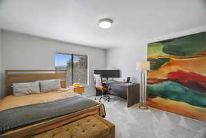 Bedroom with light colored carpet