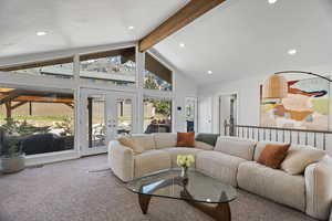 Living area with french doors, carpet floors, and recessed lighting