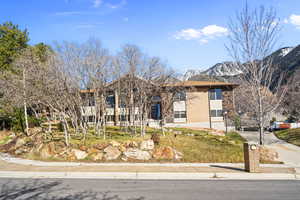 View of front of house with brick siding and a mountain view