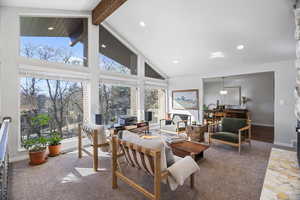 Living area featuring baseboards and recessed lighting