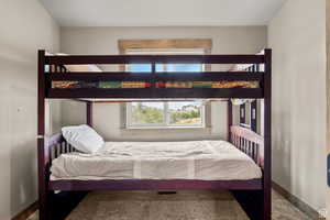 Carpeted bedroom with baseboards