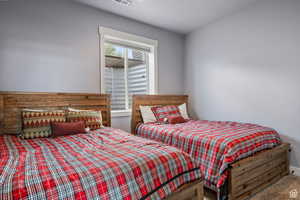Carpeted bedroom featuring a textured ceiling