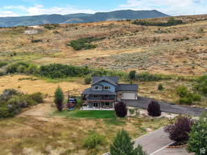 Aerial view of sparsely populated area featuring a mountain backdrop