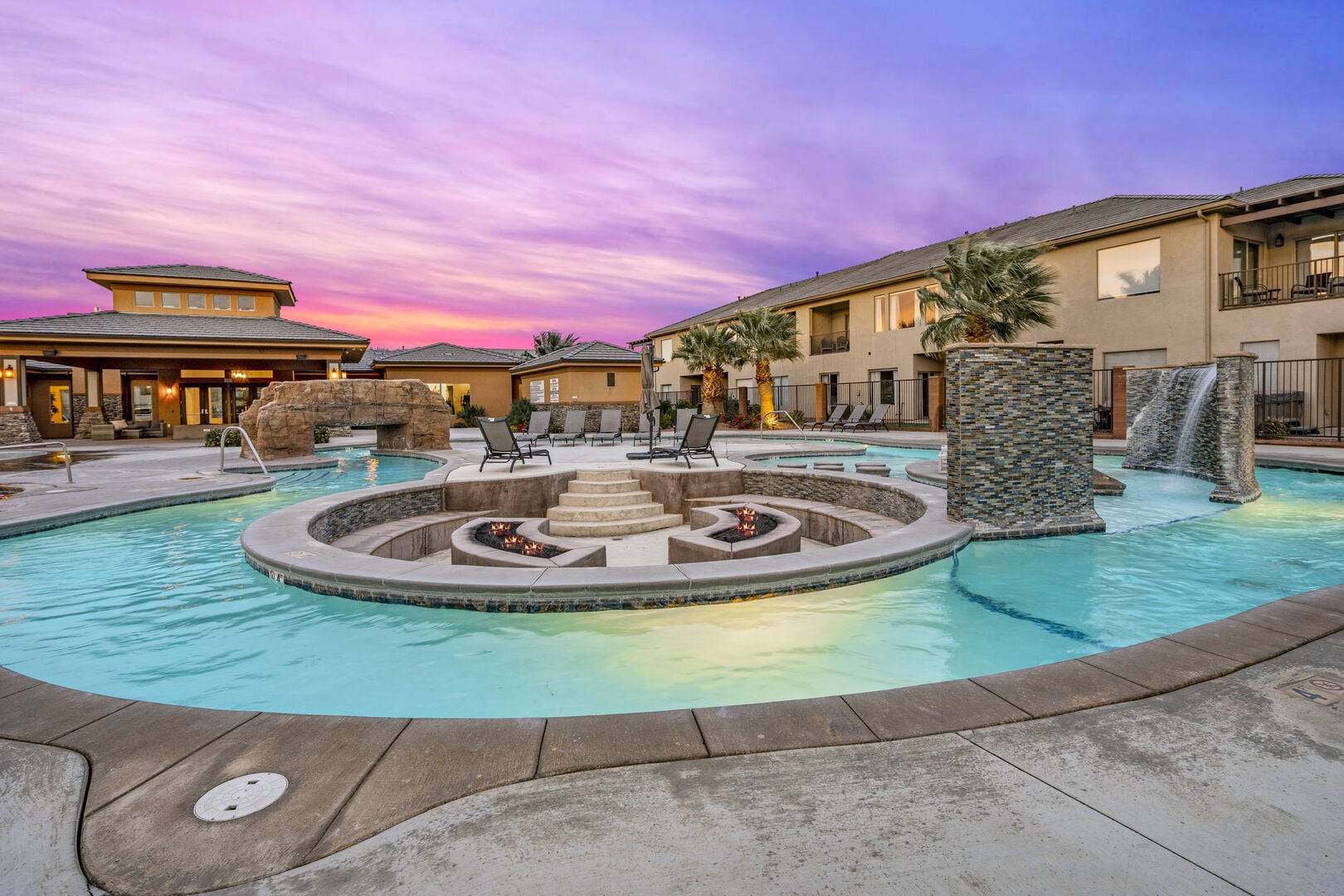 Community pool featuring a patio and an in-ground hot tub