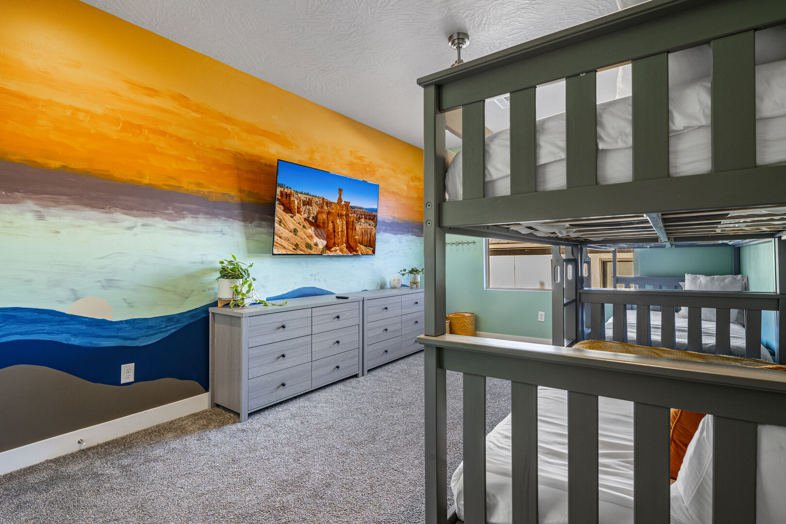 Bedroom featuring light carpet and a textured ceiling