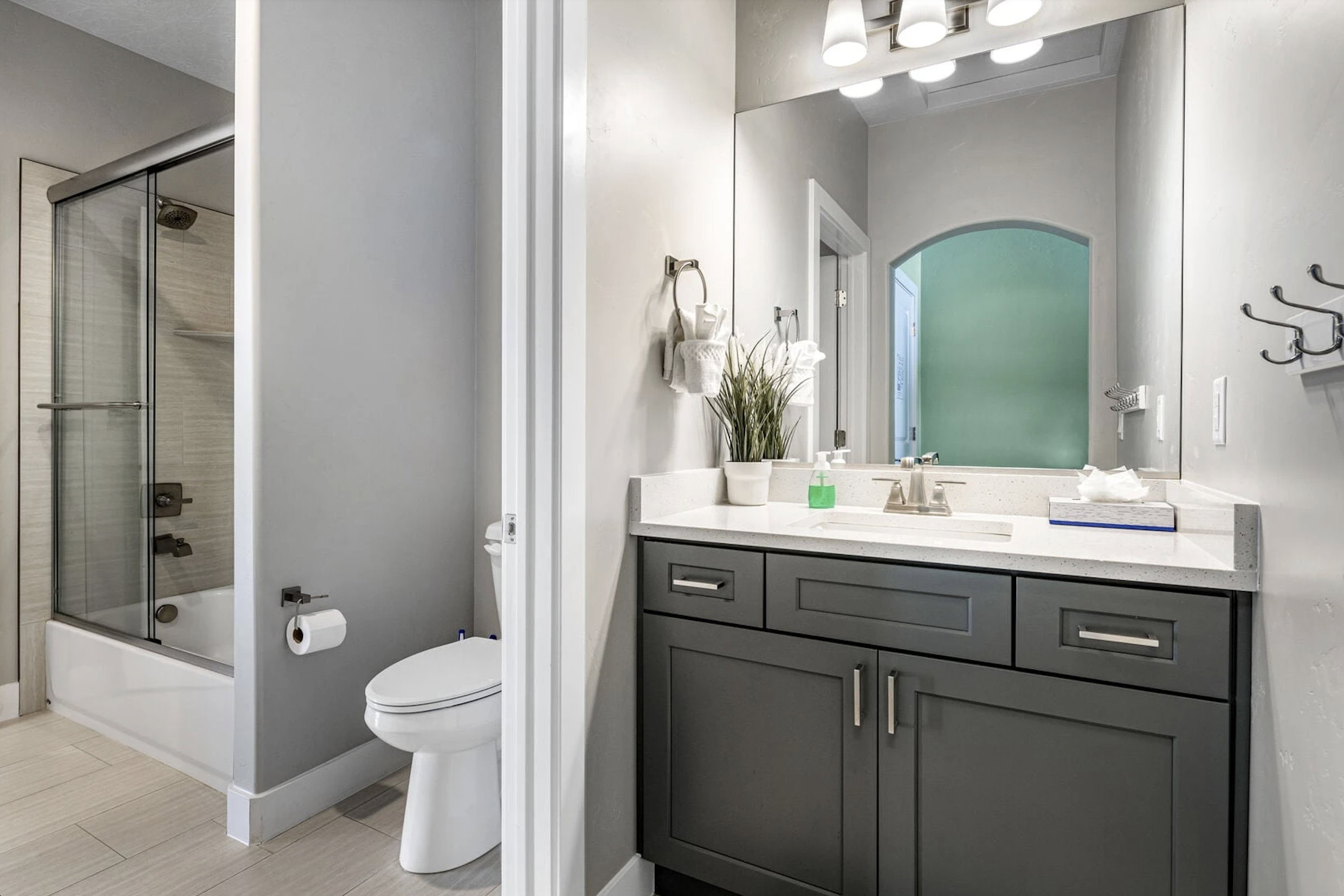 Bathroom with vanity and shower / bath combination with glass door