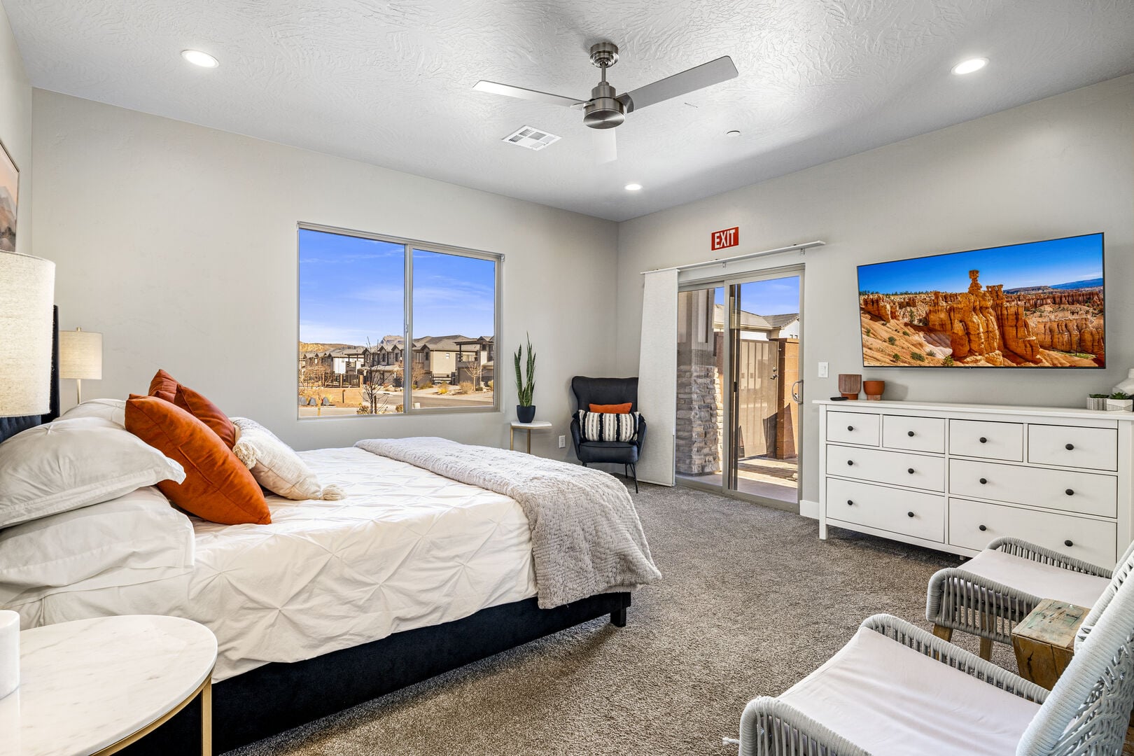 Bedroom featuring multiple windows, access to exterior, carpet floors, ceiling fan, and recessed lighting