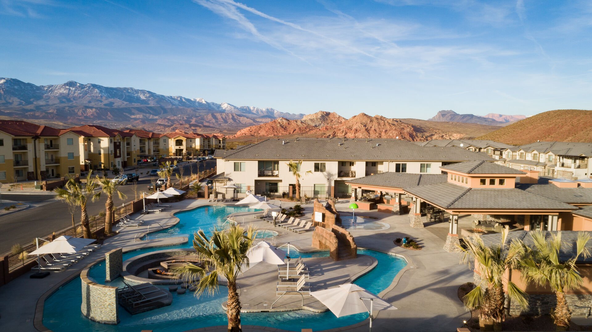 Community pool featuring a patio, a mountain view, a residential view, and a hot tub