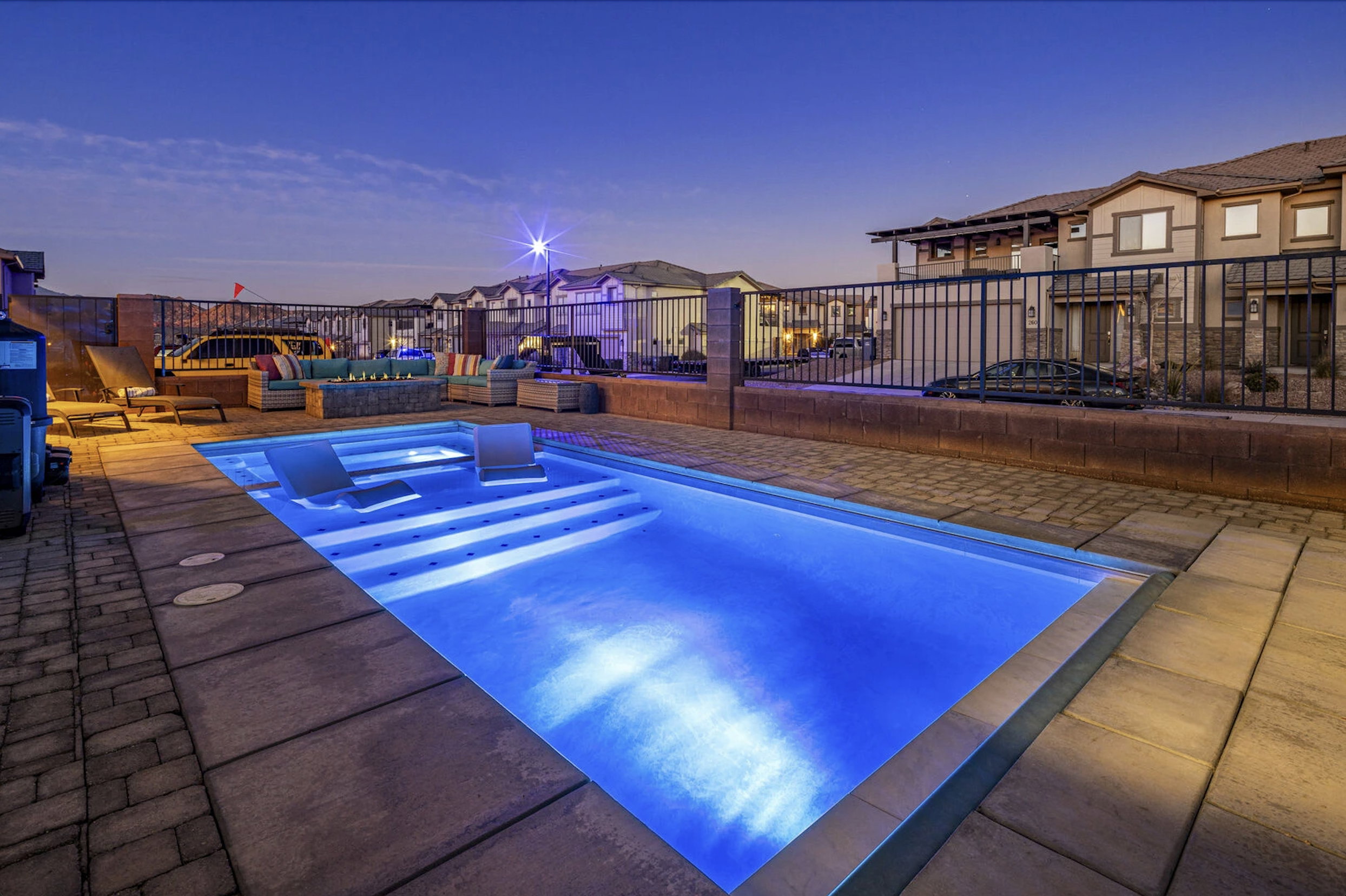 View of pool with patio surround and a jacuzzi