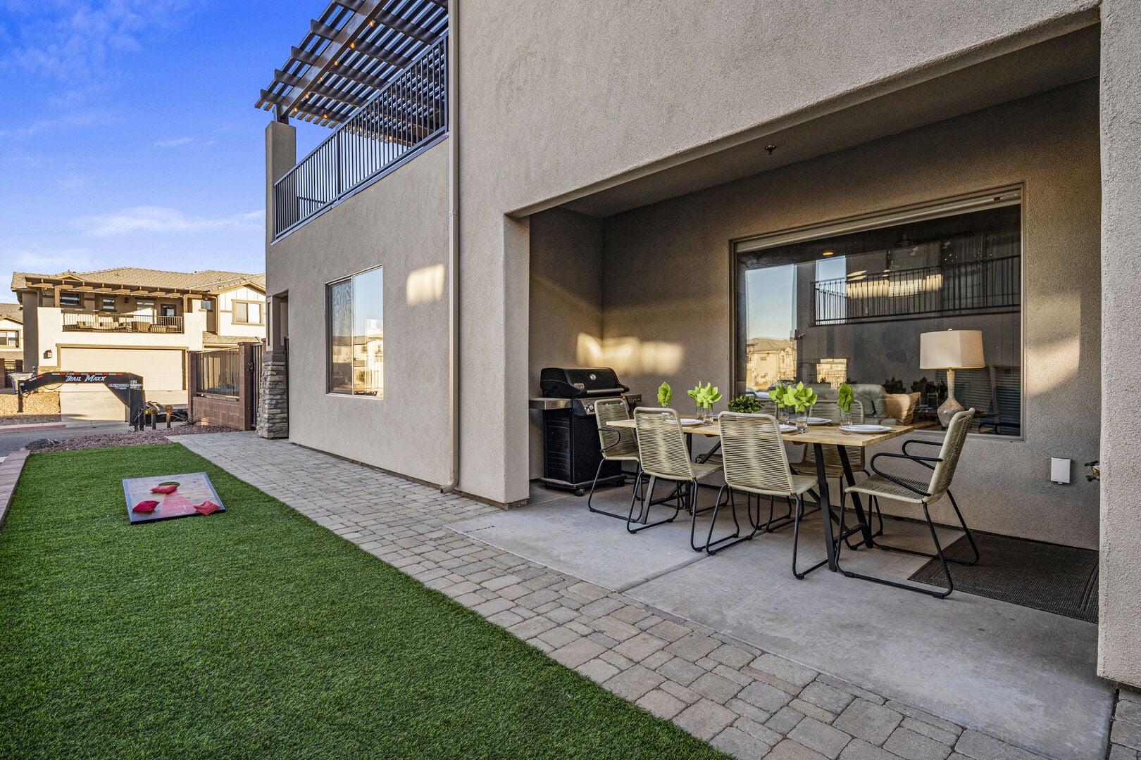 View of patio with a pergola, outdoor dining area, and grilling area