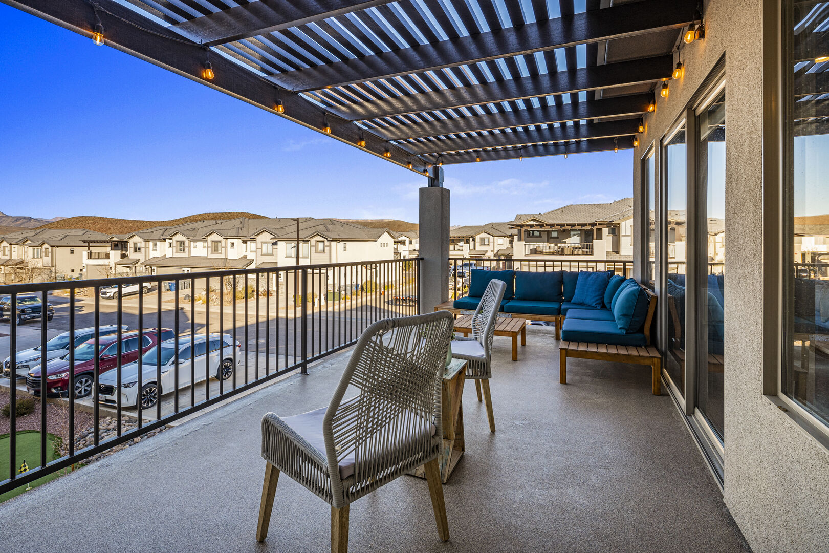 Balcony featuring a residential view, an outdoor hangout area, and a pergola