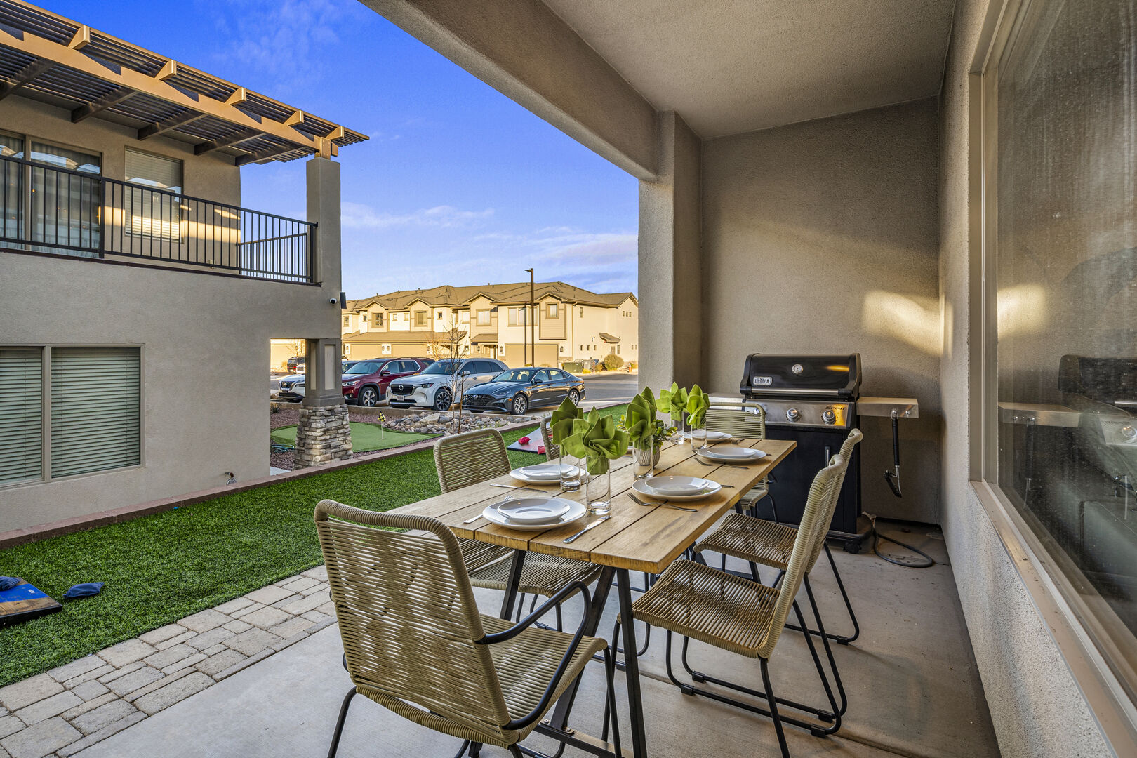 Balcony with outdoor dining space and grilling area