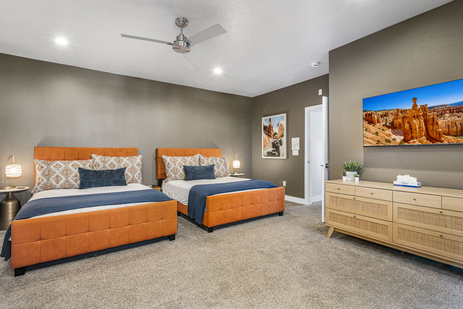 Bedroom with light colored carpet, a ceiling fan, and recessed lighting