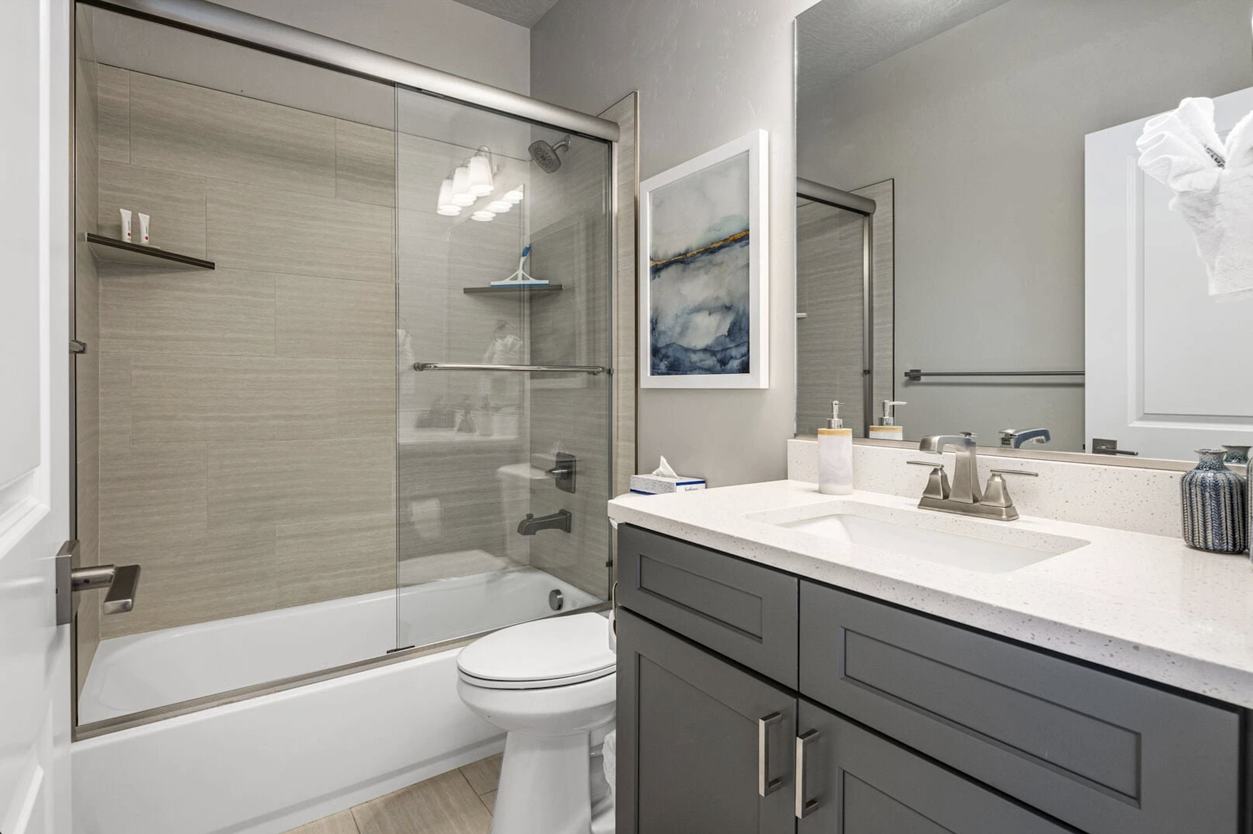 Full bathroom featuring vanity and combined bath / shower with glass door