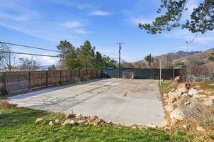 View of swimming pool featuring a fenced backyard, patio surround, and a gate