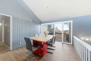 Dining room with vaulted ceiling and wood finished floors