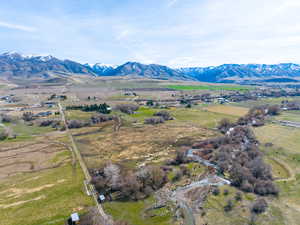 View of mountain backdrop with rural landscape