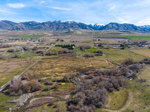 View of mountain backdrop with rural landscape