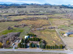 Aerial view of sparsely populated area featuring a mountain backdrop