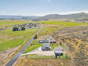 Aerial view of sparsely populated area with a mountainous background