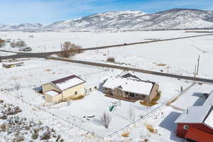 Snowy aerial view with a mountain view