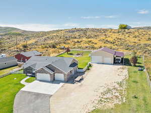 Aerial view of sparsely populated area with a desert landscape and a mountainous background