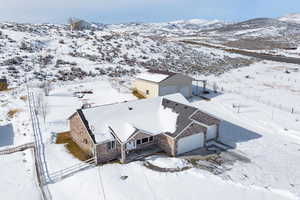 Snowy aerial view with a mountain view