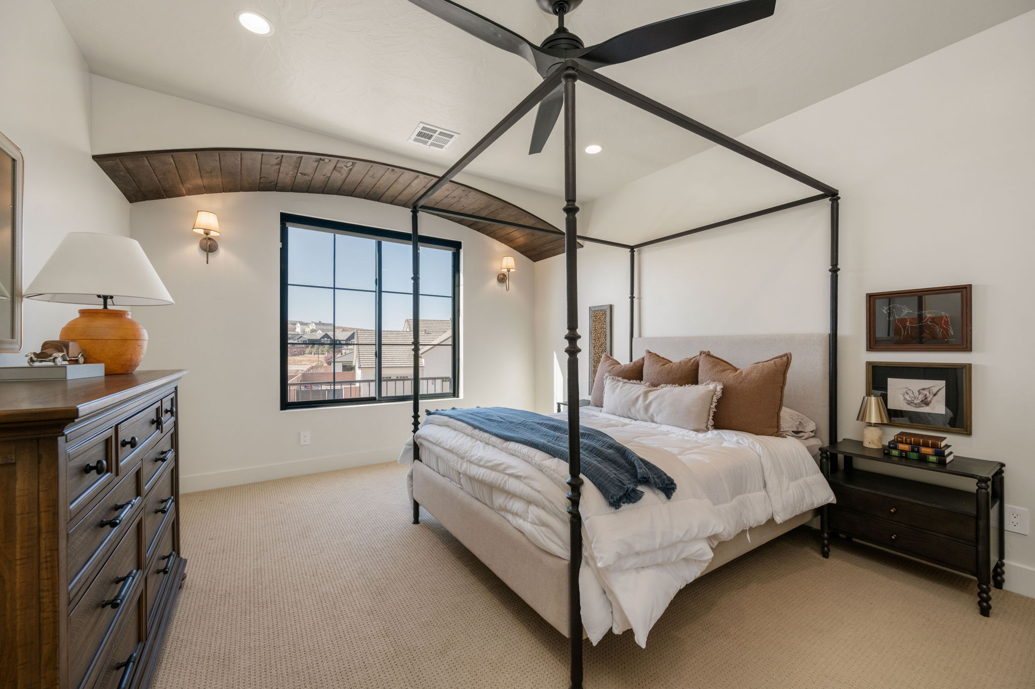 Bedroom with light colored carpet, a ceiling fan, and recessed lighting