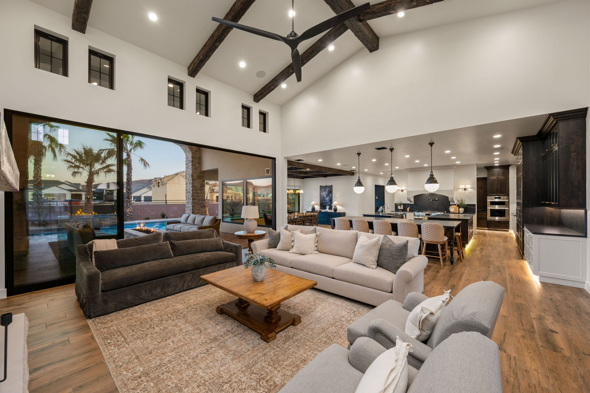 Living room featuring light wood-type flooring, recessed lighting, and vaulted ceiling