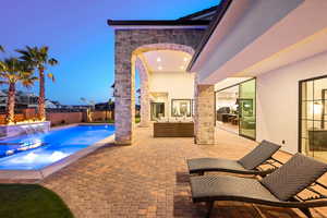 View of swimming pool featuring patio surround, outdoor lounge area, and a fenced backyard