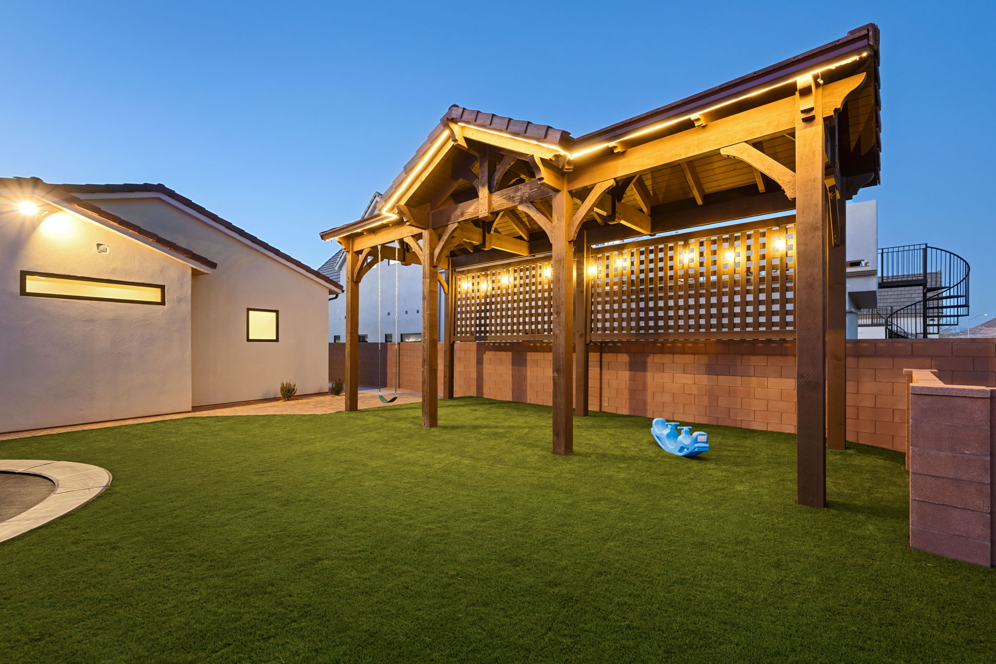 Yard at dusk featuring a fenced backyard and a patio