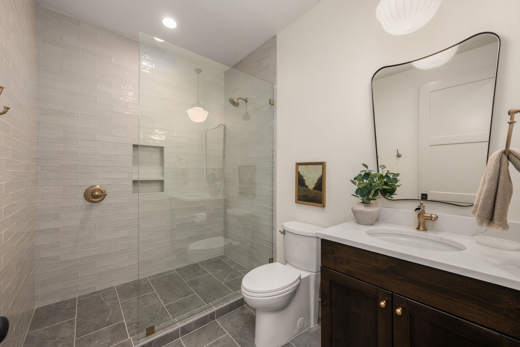 Full bath with vanity, a walk in shower, dark tile patterned flooring, and recessed lighting