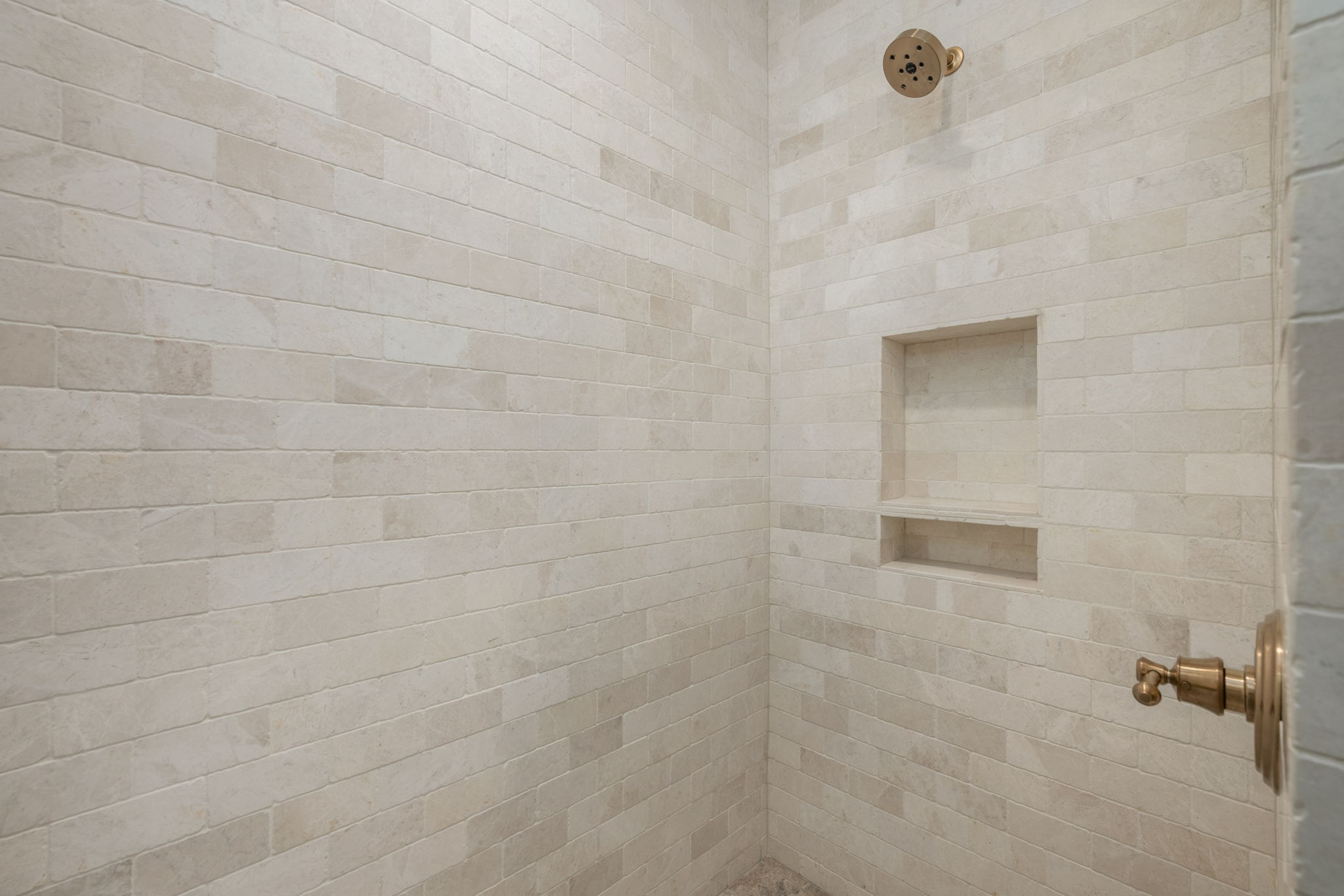 Bathroom featuring tiled shower