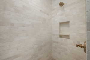 Bathroom featuring tiled shower