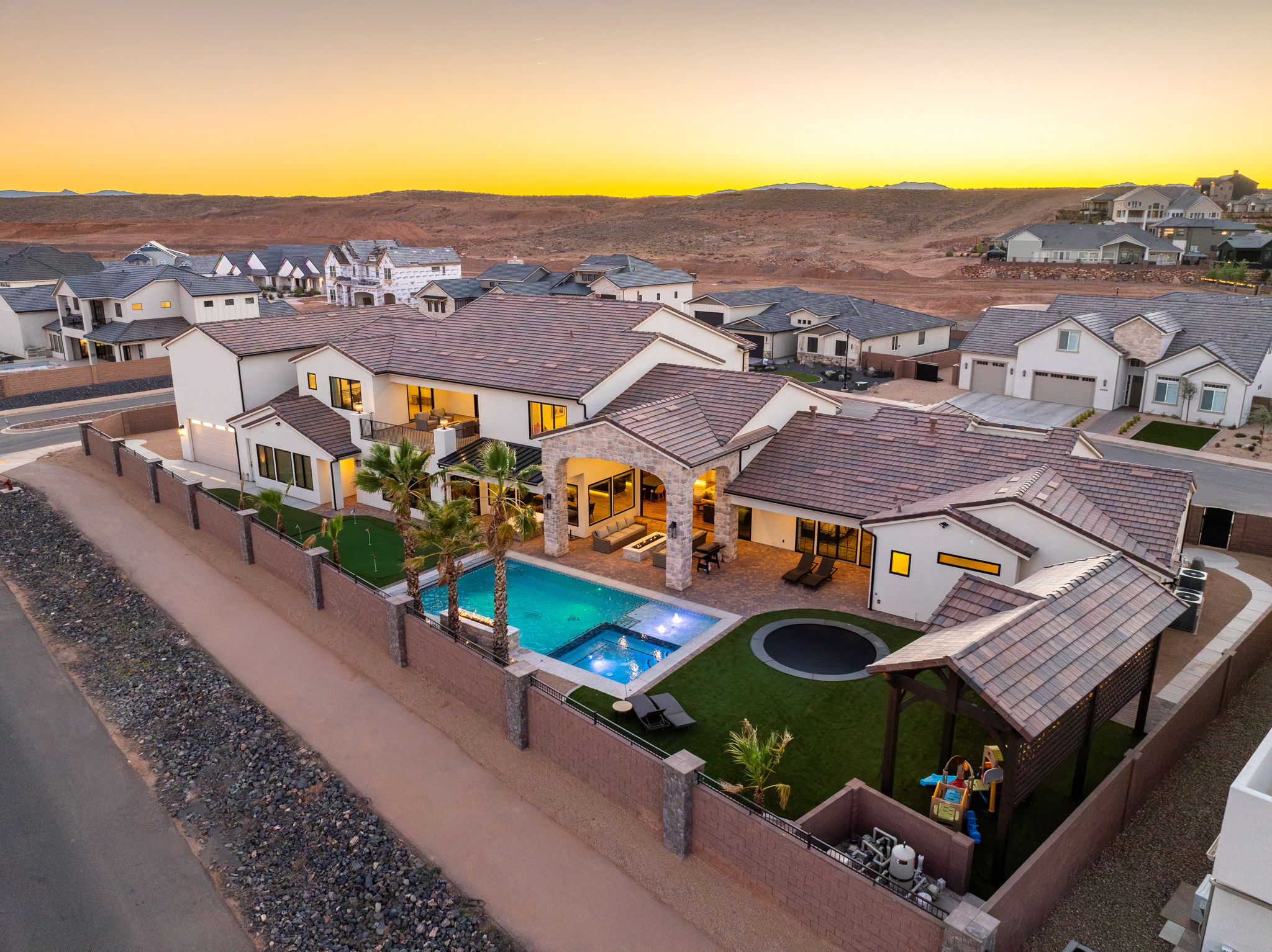 Relaxing pool / spa featuring a residential view, a patio, and a fenced backyard