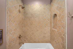 Bathroom featuring shower / washtub combination