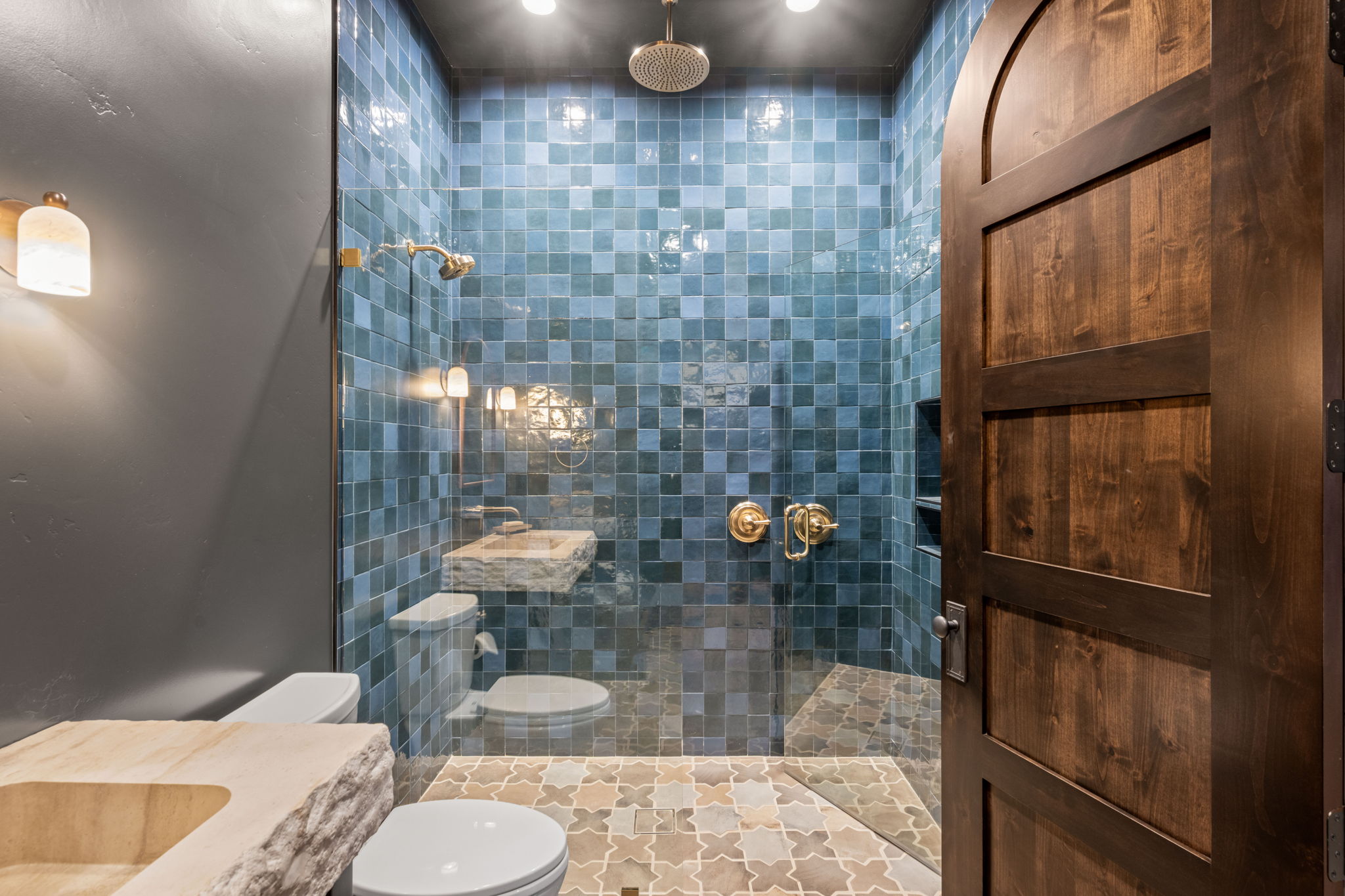 Full bathroom featuring a walk in shower and vanity
